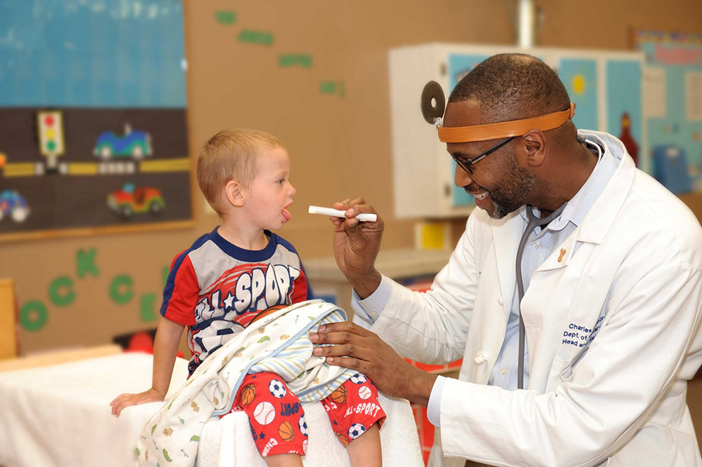 Black-Doctor-checking-on-little-boy